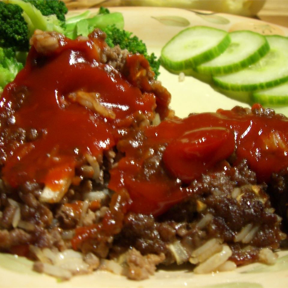 meatloaf and rice:meatloaf accompanied by rice