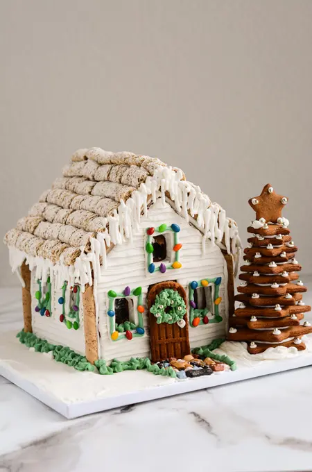 white gingerbread house:winter cottage with snowy icing