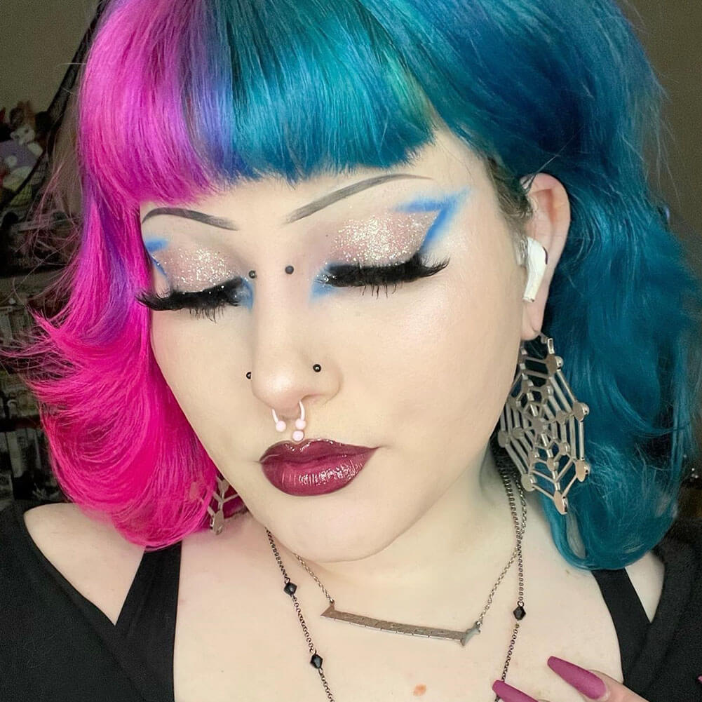 pink septum ring:rose-colored septum piercing